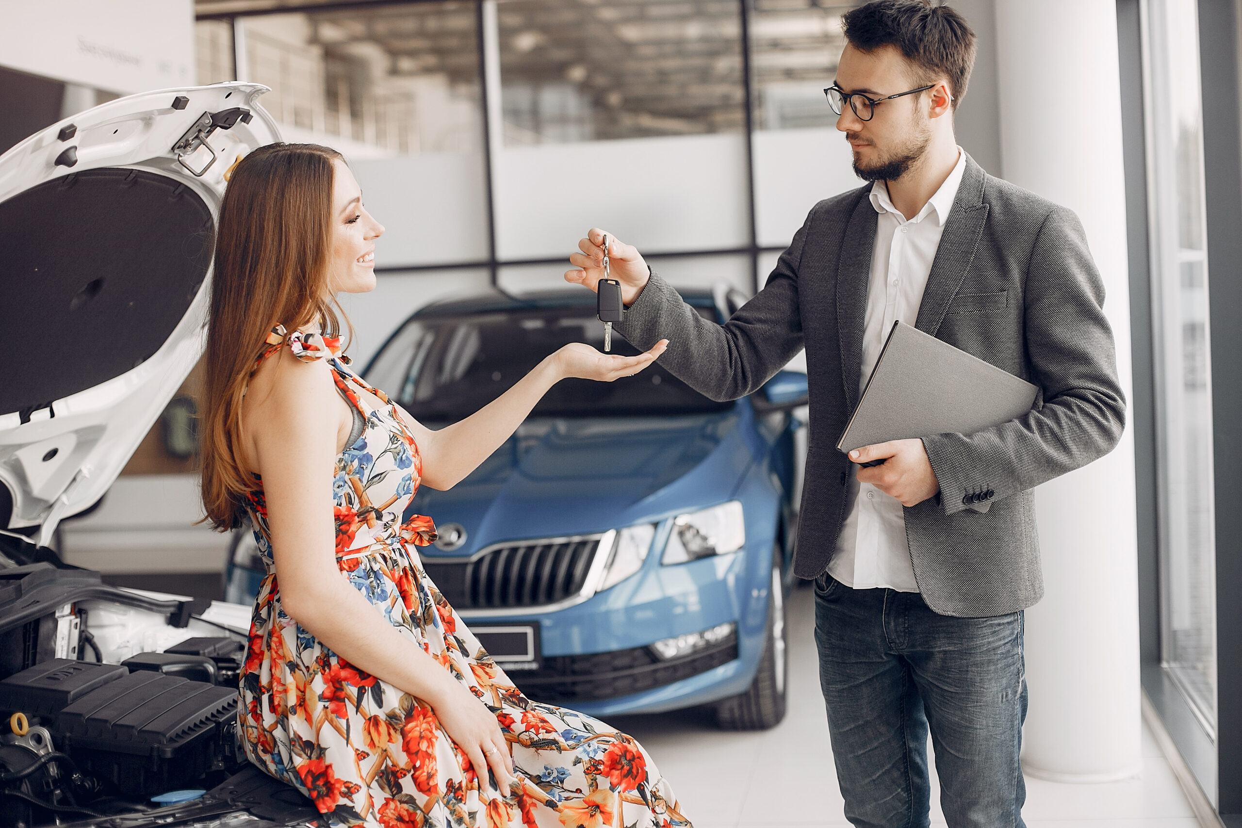 Stylish and elegant woman in a car salon